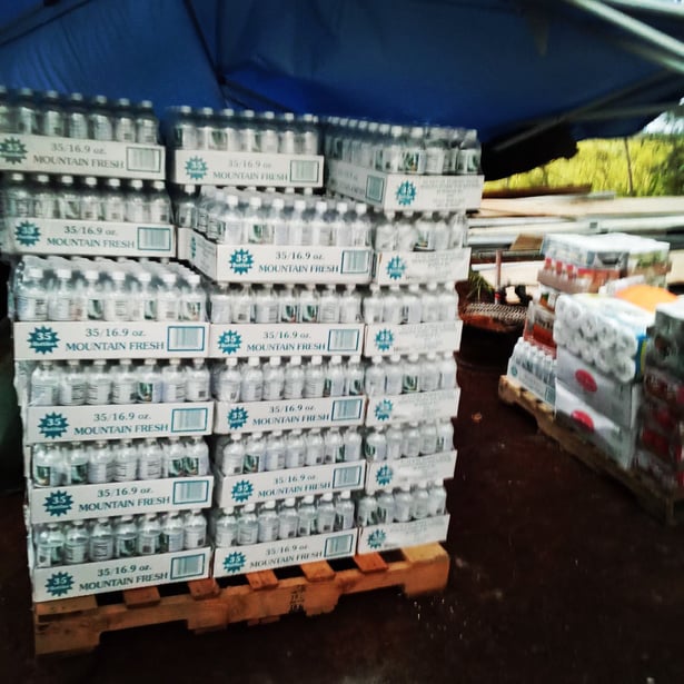 Pallets of bottled water provided for community distribution