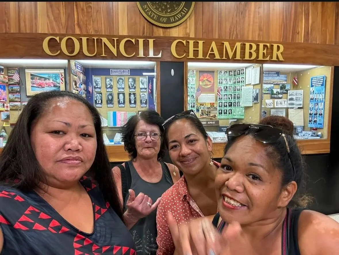 Holomua Outreach community advocates gathered outside the Maui County Council chamber